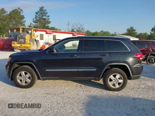 2012 Jeep Grand Cherokee Laredo with VIN 1C4RJFAG5CC234382, listed as a IAAI auction lot 42010153 with 185,078 mi miles. Bid and sale history available at carsss.com. Image 14.