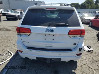 2017 Jeep Grand Cherokee Overland with VIN 1C4RJFCT5HC777748, listed as a Copart auction lot 63121635 with 106,991 mi miles and Salvage title. Bid and sale history available at DreamBid. Image 6.
