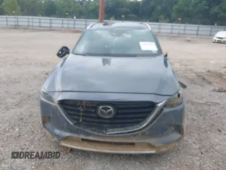 2021 Mazda CX-9 Grand Touring with VIN JM3TCADY2M0509286, listed as a IAAI auction lot 39976279 with 93,588 mi miles and . Bid and sale history available at DreamBid. Image 13.
