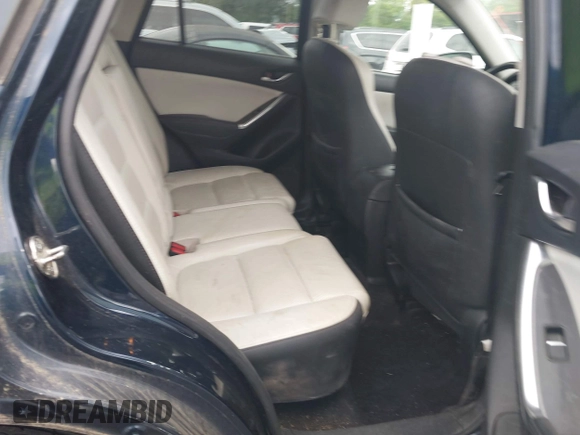 2016 Mazda CX-5 Grand Touring with VIN JM3KE2DYXG0890174, listed as a IAAI auction lot 42157884 with 141,873 mi miles. Bid and sale history available at carsss.com. Image 8.