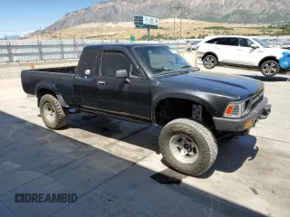 1990 Toyota Pickup DLX with VIN JT4RN93P3L5021924, listed as a Copart auction lot 64699075 with 287,298 mi miles and Clean title. Bid and sale history available at DreamBid. Image 4.