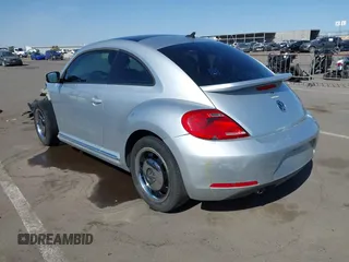 2013 Volkswagen Beetle 2.5L w/Sun/Sound/Nav with VIN 3VWJX7AT5DM606119, listed as a IAAI auction lot 41970253 with 81,004 mi miles and . Bid and sale history available at DreamBid. Image 3.