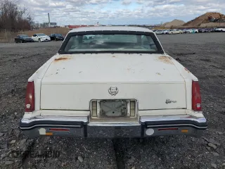 1985 Cadillac Eldorado z VIN 1G6EL578XFE673656, wystawiony jako Copart lot #86803334 z przebiegiem 94 396 mil mil oraz Tytuł czysty. Historia ofert i sprzedaży dostępna na DreamBid. Obrazek 6.