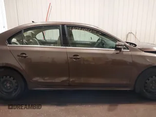 2014 Volkswagen Jetta TDI w/Premium with VIN 3VWLL7AJ1EM358214, listed as a IAAI auction lot 42148435 with 174,923 mi miles and . Bid and sale history available at DreamBid. Image 14.