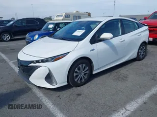 2021 Toyota Prius LE with VIN JTDKAMFP7M3197111, listed as a IAAI auction lot 42031569 with 240,098 mi miles and . Bid and sale history available at DreamBid. Image 2.