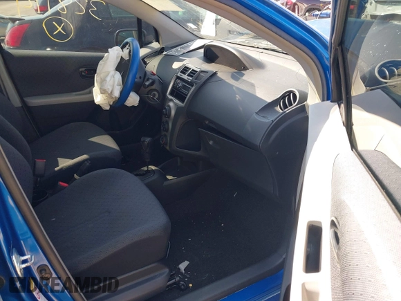 2009 Toyota Yaris with VIN JTDKT903X95257701, listed as a IAAI auction lot 41796420 with 86,953 mi miles. Bid and sale history available at carsss.com. Image 5.