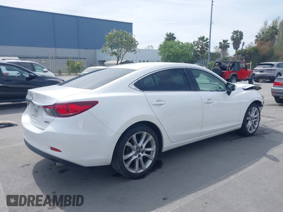 2016 Mazda Mazda6 i Touring with VIN JM1GJ1V57G1429887, listed as a IAAI auction lot 42029170 with 140,519 mi miles. Bid and sale history available at carsss.com. Image 4.