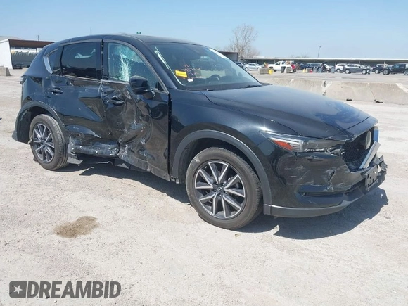 2018 Mazda CX-5 Grand Touring with VIN JM3KFADM8J0330035, listed as a IAAI auction lot 41878680 with 62,632 mi miles. Bid and sale history available at carsss.com. Image 1.