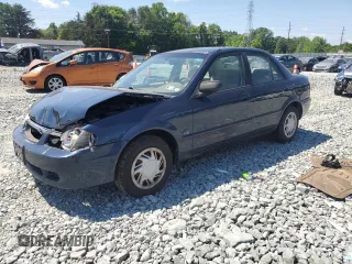 1999 Mazda Protege DX z VIN JM1BJ2229X0137724, wystawiony jako Copart lot #55149115 z przebiegiem 173 108 mil mil oraz Szkoda całkowita • Salvage title. Historia ofert i sprzedaży dostępna na DreamBid. Obrazek 1.
