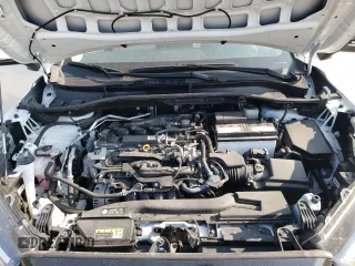 2023 Toyota Corolla Cross LE with VIN 7MUCAABG3PV060880, listed as a Copart auction lot 59664915 with 18,246 mi miles and Salvage title. Bid and sale history available at DreamBid. Image 12.