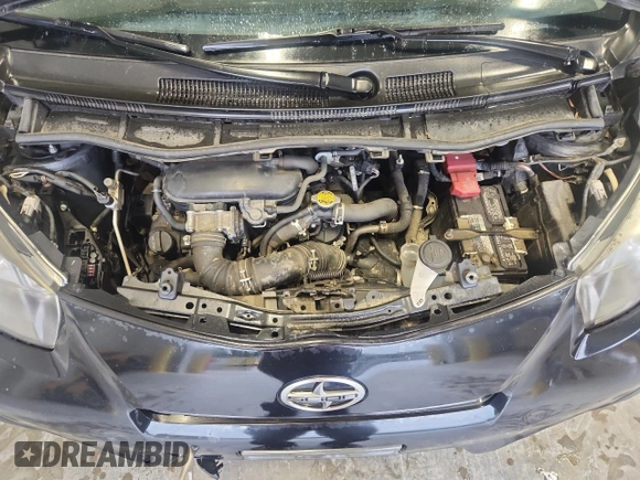 2012 Scion iQ z VIN JTNJJXB04CJ012587, wystawiony jako Copart lot #58191845 z przebiegiem 104 601 mil mil oraz Szkoda całkowita • Salvage title. Historia ofert i sprzedaży dostępna na DreamBid. Obrazek 11.