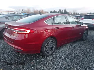 2017 Ford Fusion Energi SE with VIN 3FA6P0PU3HR277659, listed as a IAAI auction lot 41297011 with 119,244 mi miles. Bid and sale history available at carsss.com. Image 4.