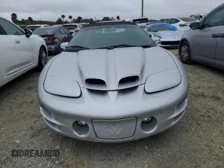 2002 Pontiac Firebird Trans Am z VIN 2G2FV32GX22126136, wystawiony jako Copart lot #74893254 z przebiegiem 7725 mil mil oraz Szkody całkowita. Historia ofert i sprzedaży dostępna na DreamBid. Obrazek 5.