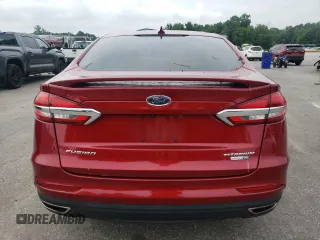 2019 Ford Fusion Titanium z VIN 3FA6P0D99KR221328, wystawiony jako Copart lot #57104515 z przebiegiem 138 427 mil mil oraz Szkoda całkowita • Salvage title. Historia ofert i sprzedaży dostępna na DreamBid. Obrazek 6.
