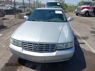 2003 Cadillac Seville Luxury SLS z VIN 1G6KS54Y43U214795, wystawiony jako IAAI lot #42348542 z przebiegiem 144 438 mil mil oraz . Historia ofert i sprzedaży dostępna na DreamBid. Obrazek 12.