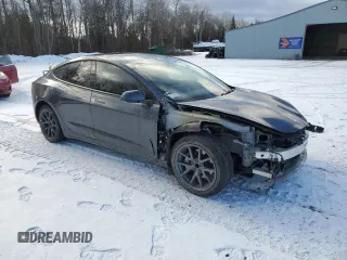 2023 Tesla Model 3 with VIN 5YJ3E1EA7PF496089, listed as a Copart auction lot 87101254 with 42,830 mi miles and Salvage Title. Bid and sale history available at DreamBid. Image 4.