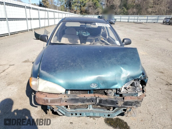 1999 Hyundai Accent z VIN KMHVD14N4XU456698, wystawiony jako Copart lot #41733345 z przebiegiem 197 574 mil mil oraz Szkody całkowita. Historia ofert i sprzedaży dostępna na DreamBid. Obrazek 5.