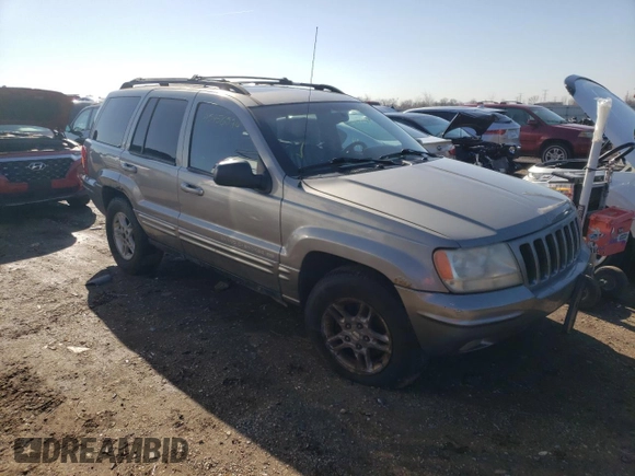1999 Jeep Grand Cherokee Limited with VIN 1J4GW68N8XC770353, listed as a Copart auction lot 74670614 with Not provided miles and Non repairable. Bid and sale history available at DreamBid. Image 4.