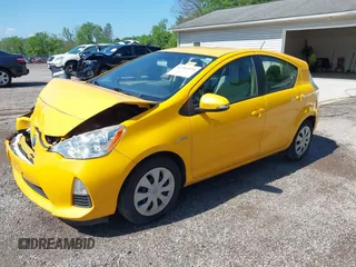 2014 Toyota Prius One z VIN JTDKDTB31E1066984, wystawiony jako IAAI lot #42261574 z przebiegiem 163 378 mil mil oraz . Historia ofert i sprzedaży dostępna na DreamBid. Obrazek 2.