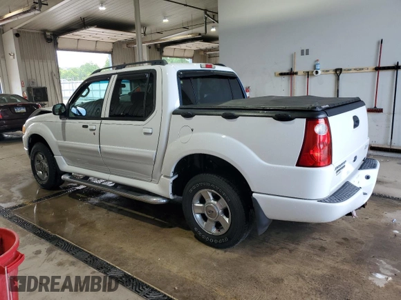 2004 Ford Explorer Sport Trac XLS with VIN 1FMZU77K74UB23543, listed as a Copart auction lot 62859625 with 96,873 mi miles and Salvage title. Bid and sale history available at DreamBid. Image 2.