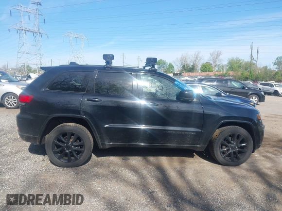 2018 Jeep Grand Cherokee Laredo E with VIN 1C4RJFAG2JC320441, listed as a IAAI auction lot 42095419 with 136,962 mi miles. Bid and sale history available at carsss.com. Image 13.