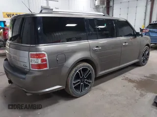 2014 Ford Flex Limited z VIN 2FMHK6DT2EBD25030, wystawiony jako IAAI lot #42148170 z przebiegiem 135 300 mil mil oraz . Historia ofert i sprzedaży dostępna na DreamBid. Obrazek 4.