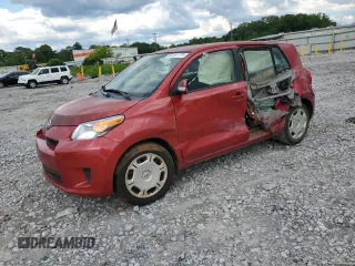 2014 Scion xD with VIN JTKKUPB44E1040937, listed as a Copart auction lot 56154725 with 157,140 mi miles and Salvage title. Bid and sale history available at DreamBid. Image 1.