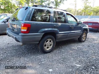 2001 Jeep Grand Cherokee Laredo with VIN 1J4GW48SX1C585867, listed as a IAAI auction lot 42793657 with 197,167 mi miles and . Bid and sale history available at DreamBid. Image 4.