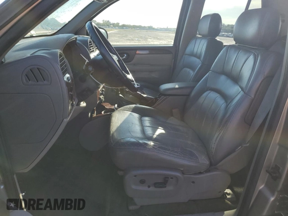 2002 GMC Envoy SLT with VIN 1GKDT13S122491329, listed as a Copart auction lot 75161714 with 149,659 mi miles and Salvage Title. Bid and sale history available at DreamBid. Image 7.
