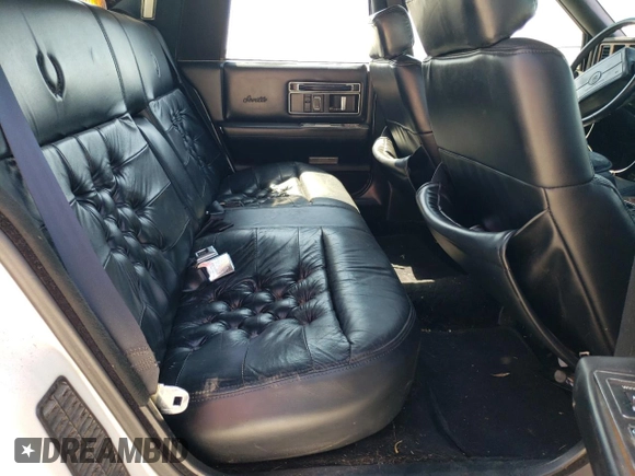 1991 Cadillac Seville z VIN 1G6KS53B9MU824142, wystawiony jako Copart lot #74276264 z przebiegiem 103 517 mil mil oraz Szkody całkowita. Historia ofert i sprzedaży dostępna na DreamBid. Obrazek 10.