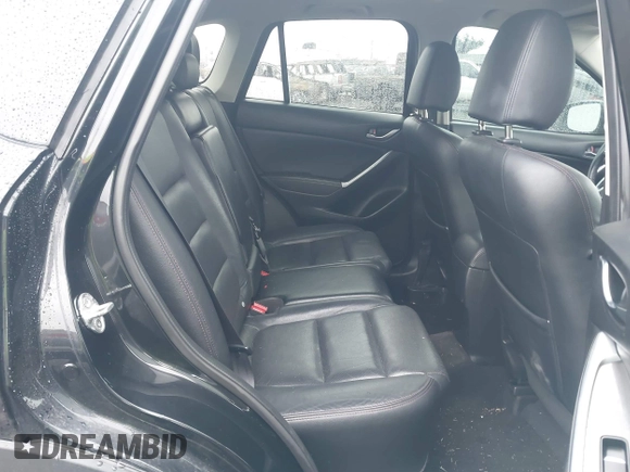 2016 Mazda CX-5 Grand Touring z VIN JM3KE4DY5G0742686, wystawiony jako IAAI lot #41598719 z przebiegiem 117 643 mil mil oraz . Historia ofert i sprzedaży dostępna na DreamBid. Obrazek 8.