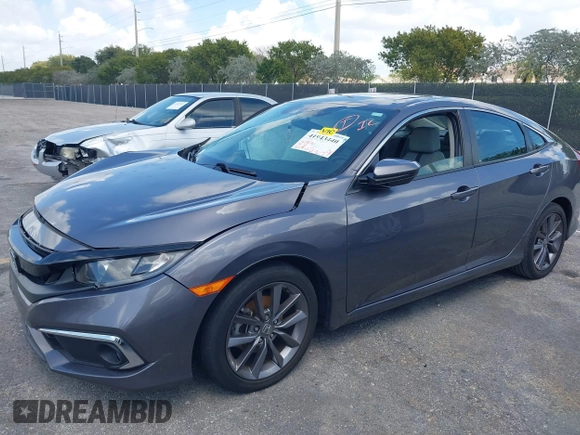 2021 Honda Civic Sedan EX with VIN 19XFC1F34ME001481, listed as a IAAI auction lot 41943440 with 35,851 mi miles. Bid and sale history available at carsss.com. Image 2.