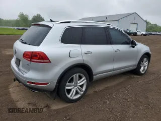 2014 Volkswagen Touareg Sport с VIN WVGEF9BP0ED014429, выставлен на аукционе Copart как лот 58692875 с пробегом 157 417 миль миль и Списание • Salvage title. История ставок и продаж доступна на DreamBid. Изображение 3.