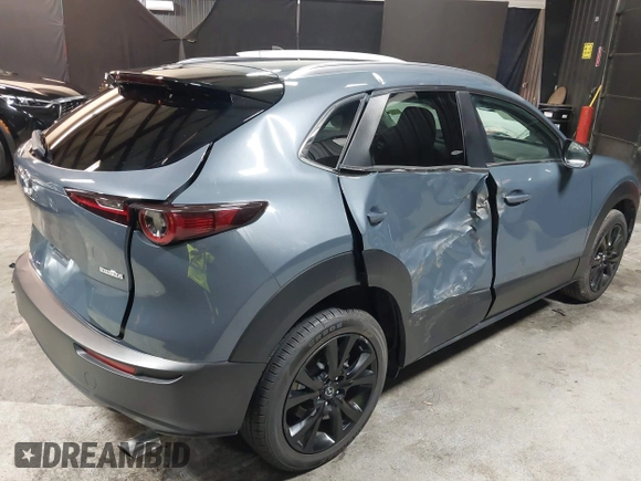 2022 Mazda CX-30 S Carbon Edition with VIN 3MVDMBCL8NM447234, listed as a IAAI auction lot 42511600 with 51,926 mi miles and . Bid and sale history available at DreamBid. Image 6.