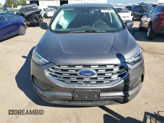 2021 Ford Edge SE z VIN 2FMPK4G98MBA23711, wystawiony jako Copart lot #76259054 z przebiegiem 20 879 mil mil oraz Czysty tytuł • Clean title. Historia ofert i sprzedaży dostępna na DreamBid. Obrazek 5.