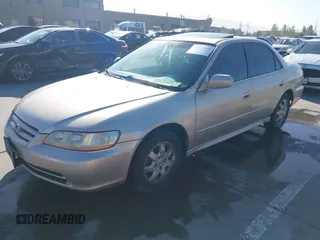 2001 Honda Accord EX z VIN JHMCG66801C010759, wystawiony jako IAAI lot #42303890 z przebiegiem 216 143 mil mil oraz . Historia ofert i sprzedaży dostępna na DreamBid. Obrazek 17.