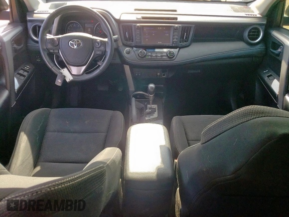 2018 Toyota RAV4 XLE with VIN 2T3RFREV7JW818661, listed as a Copart auction lot 65756615 with 56,369 mi miles and Salvage title. Bid and sale history available at DreamBid. Image 8.