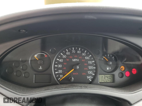 2004 Ford Focus LX with VIN 1FAFP33P24W148563, listed as a Copart auction lot 63869755 with 142,243 mi miles and Salvage title. Bid and sale history available at DreamBid. Image 9.