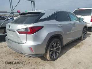 2019 Lexus RX with VIN 2T2ZZMCA3KC135292, listed as a IAAI auction lot 41573153 with 106,971 mi miles. Bid and sale history available at carsss.com. Image 4.