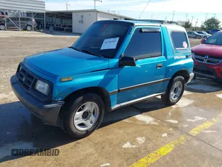 1997 Chevrolet Tracker z VIN 2CNBE1865V6904672, wystawiony jako IAAI lot #41296166 z przebiegiem 266 743 mil mil oraz . Historia ofert i sprzedaży dostępna na DreamBid. Obrazek 2.
