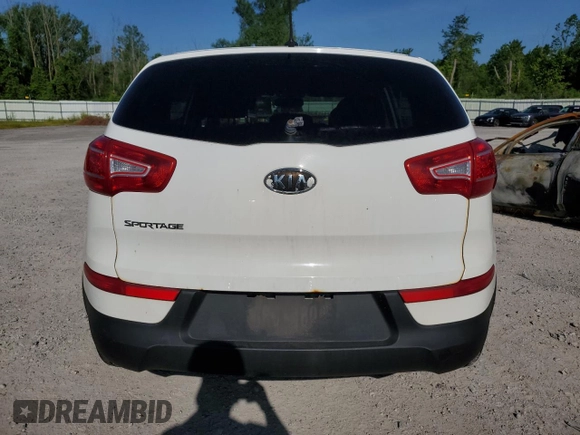 2012 Kia Sportage LX with VIN KNDPBCA21C7233424, listed as a Copart auction lot 61829465 with 129,526 mi miles and Salvage title. Bid and sale history available at DreamBid. Image 6.