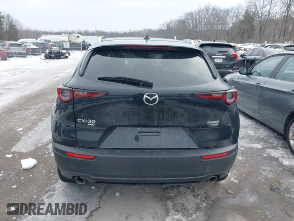 2021 Mazda CX-30 Premium with VIN 3MVDMBDY1MM269353, listed as a IAAI auction lot 41644391 with 29,409 mi miles and . Bid and sale history available at carsss.com. Image 16.