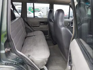 1996 Jeep Cherokee Sport z VIN 1J4FT68S6TL267408, wystawiony jako IAAI lot #42385629 z przebiegiem 268 753 mil mil oraz . Historia ofert i sprzedaży dostępna na DreamBid. Obrazek 8.