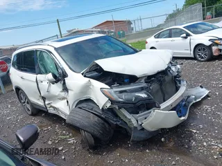 2017 Honda Pilot Touring z VIN 5FNYF6H94HB007912, wystawiony jako IAAI lot #42272533 z przebiegiem Nie podano mil oraz . Historia ofert i sprzedaży dostępna na DreamBid. Obrazek 1.