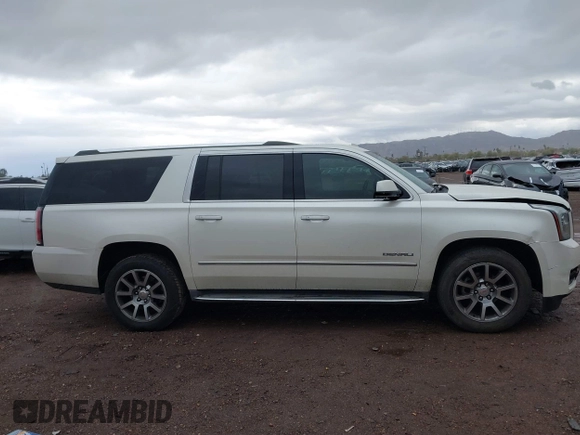 2015 GMC Yukon XL Denali with VIN 1GKS2JKJ2FR590502, listed as a IAAI auction lot 41758575 with 129,777 mi miles. Bid and sale history available at carsss.com. Image 12.