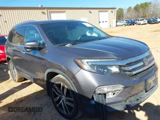 2017 Honda Pilot Touring with VIN 5FNYF5H92HB038893, listed as a IAAI auction lot 41639555 with 100,354 mi miles. Bid and sale history available at carsss.com. Image 1.