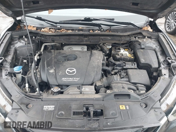 2014 Mazda CX-5 Grand Touring with VIN JM3KE4DY0E0392476, listed as a IAAI auction lot 41419144 with 89,245 mi miles and . Bid and sale history available at carsss.com. Image 10.