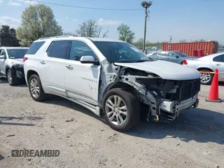 2018 Chevrolet Traverse High Country with VIN 1GNEVKKW9JJ111962, listed as a IAAI auction lot 42118324 with 104,311 mi miles and . Bid and sale history available at DreamBid. Image 1.