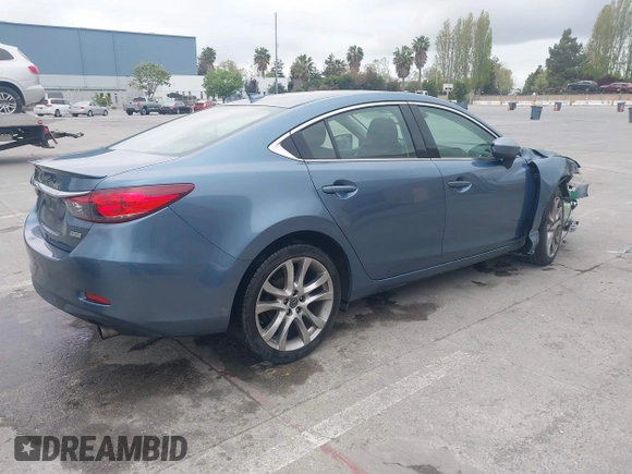 2014 Mazda 6 i Grand Touring with VIN JM1GJ1W64E1133729, listed as a IAAI auction lot 42050222 with 112,464 mi miles and . Bid and sale history available at DreamBid. Image 4.