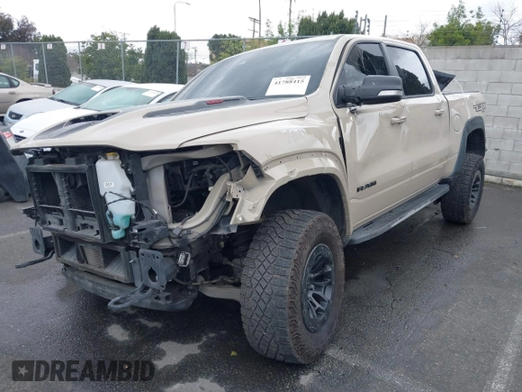 2022 Ram 1500 TRX with VIN 1C6SRFU92NN383774, listed as a IAAI auction lot 41788415 with 34,646 mi miles and . Bid and sale history available at DreamBid. Image 2.